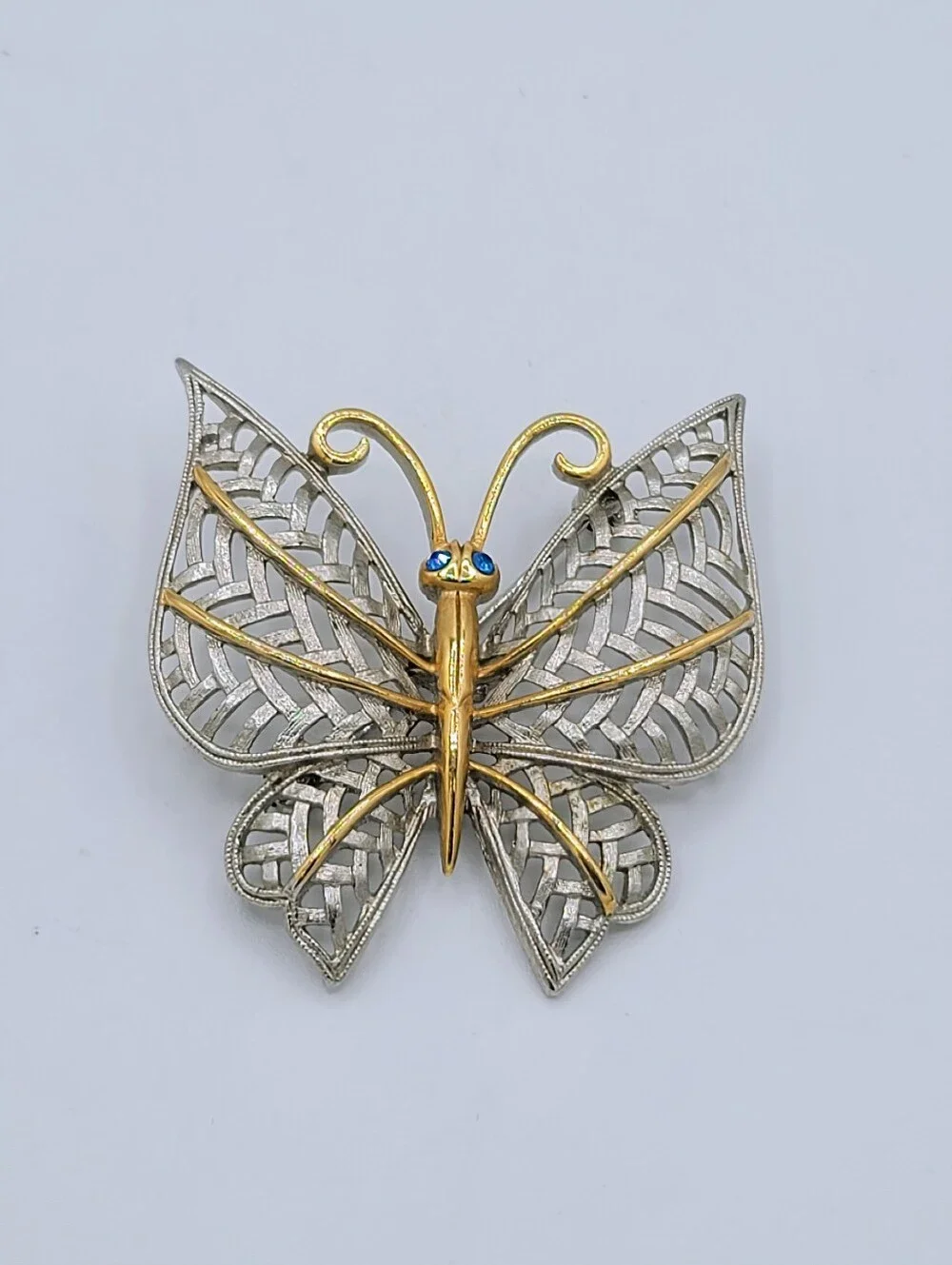 Avon Butterfly Brooch Two Tone Gold Silver Openwork Blue Rhinestone Eyes Vintage